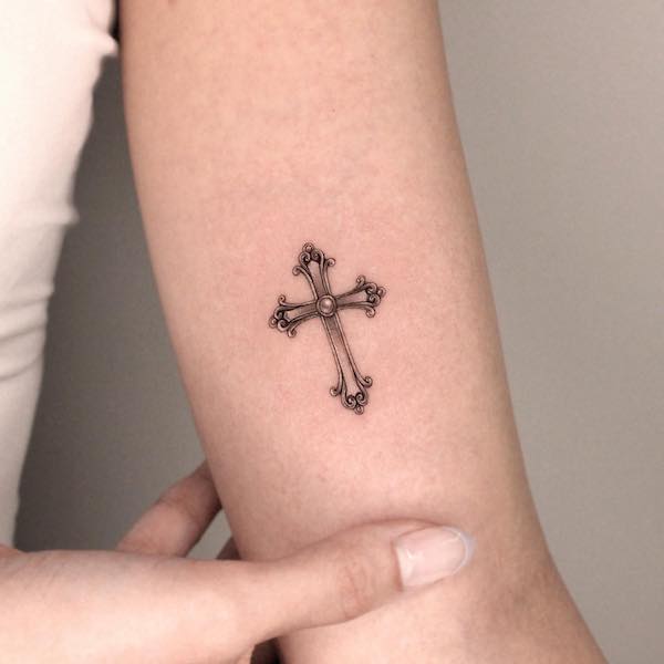 Tiny cross inner arm tattoo by @tattooist_eheon