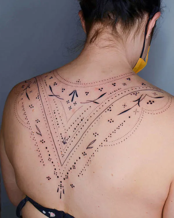 Upper back ornamental tattoo by @k_inx