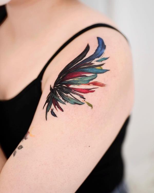 Wing tattoo on the upper arm by @9room_tattoo