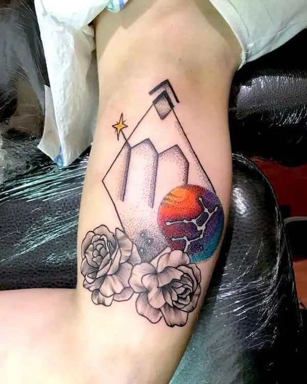 A bold colored tattoo on the arm by @orsolyatatar