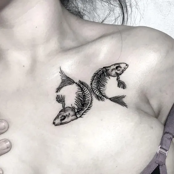 A dark skeleton fish tattoo on the chest by @freiheitink