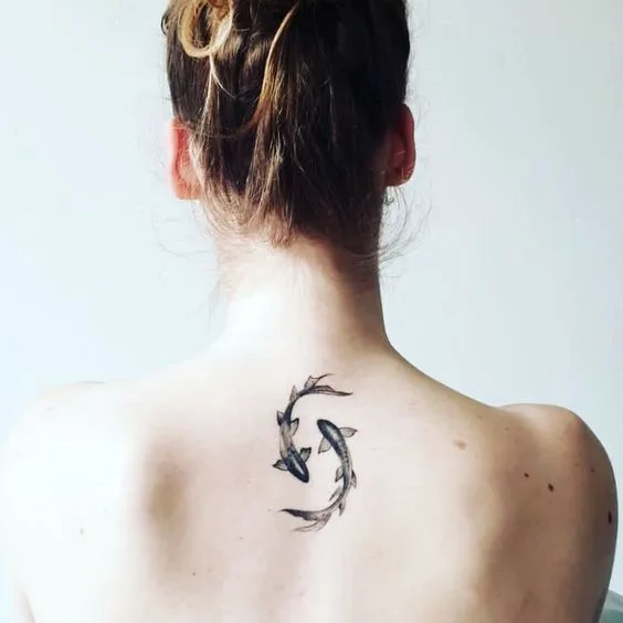 A double fish ink on the back by @oliebolletjes