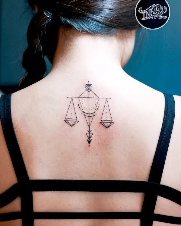 A geometric scale back tattoo by @ink22.tattoo
