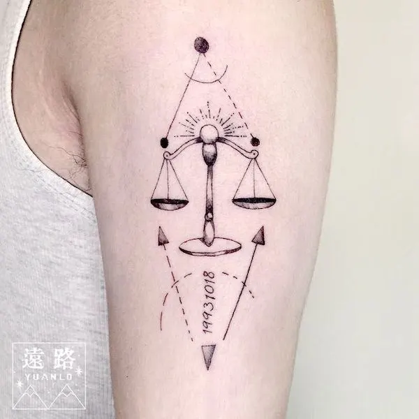 A minimalist scale tattoo to celebrate your birthday