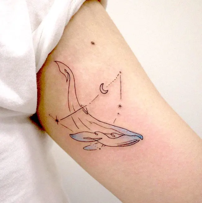 A lovely whale tattoo with Capricorn constellation by @mint_tattooist