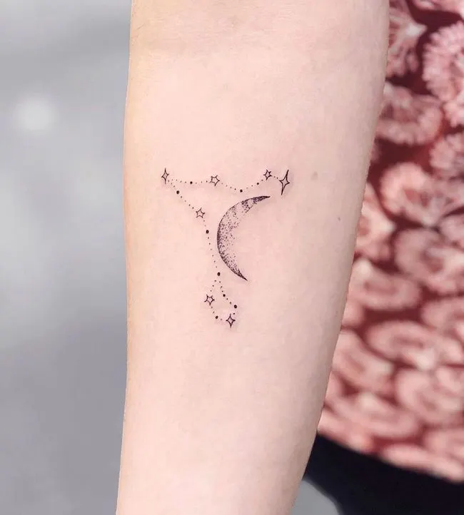 A minimalist Pieces stars and moon arm tattoo by @nothingwildtattoo