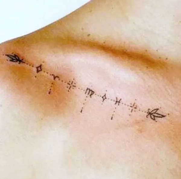 A simple zodiac tattoo below the collarbone by @benedictattoo