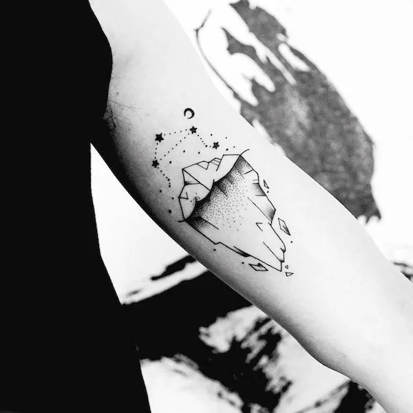 An iceberg tattoo with Libra constellation by @watsonxuan_tattoo
