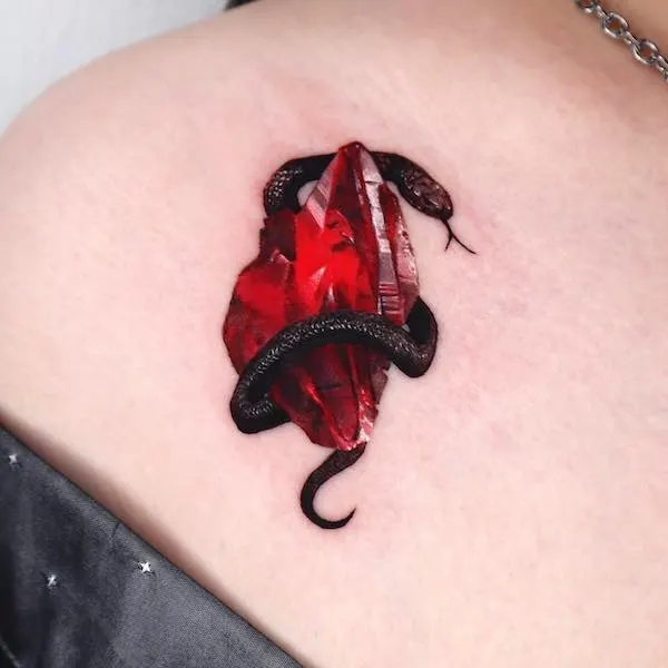 Black cobra and gemstone tattoo by @tattooist_coldy
