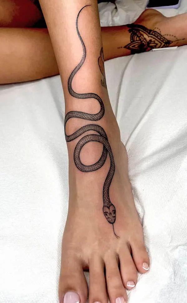 Bold snake foot tattoo by @dalila_wolf