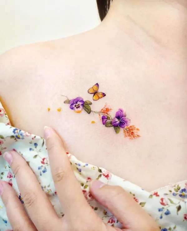 Dainty flower and butterfly tattoo by @songe.tattoo