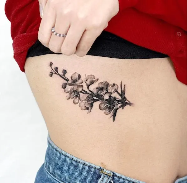 10 Delicate Flower Rib Tattoo Ideas