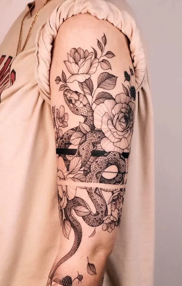 Detailed snake and flowers sleeve tattoo by @aestet.ink