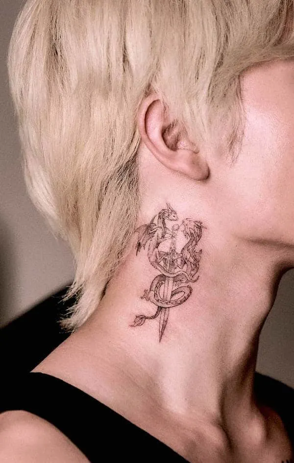 Dragons and dagger tattoo by @sonia_ink_