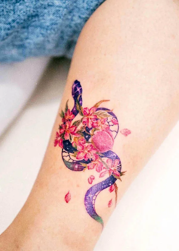Feminine floral snake tattoo by @tattooist_ou