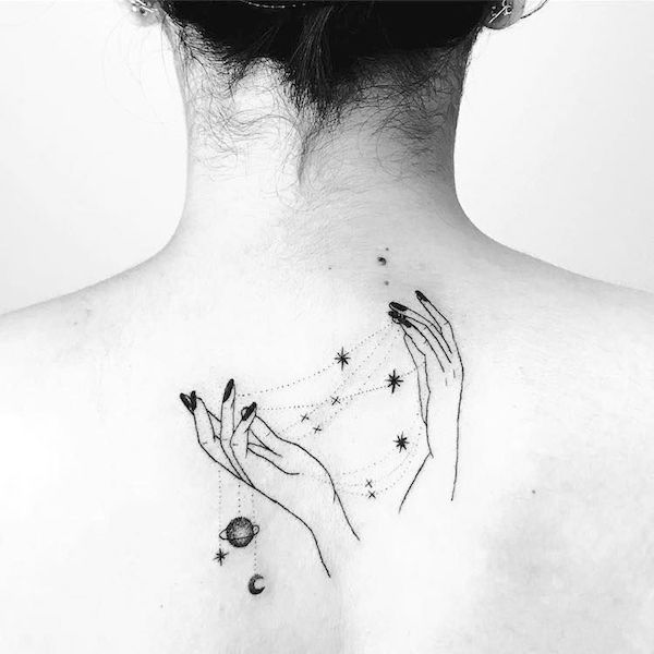 Holding your own fate a meaningful tattoo on the back by @shellysugar