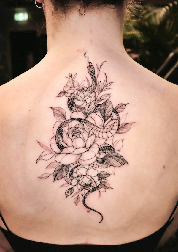 Intricate snake and flowers back tattoo for women by @miakim1984