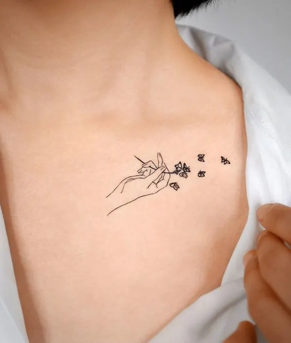 Let it fly small butterfly collarbone tattoo by @pauline.tattoo