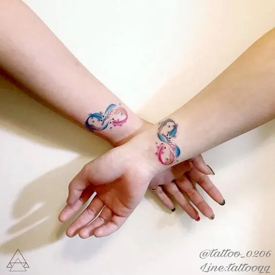 Matching watercolor Pieces wrist tattoos by @221tattoo_0206
