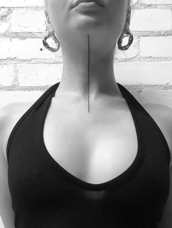 Minimalist single line throat tattoo by @elise.tattoo
