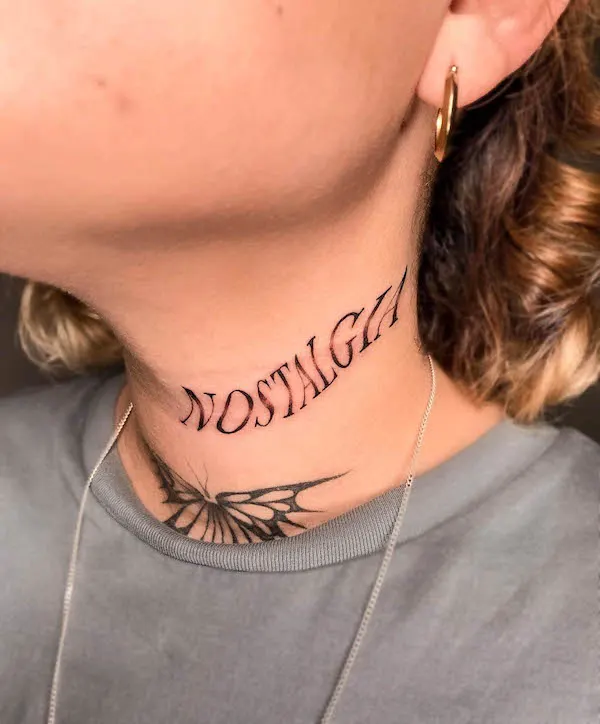 Nostalgia one-word neck tattoo by @ferandrade.tattoo