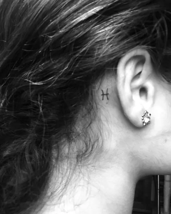 Pieces glyph tattoo behind the ear by @verutetu