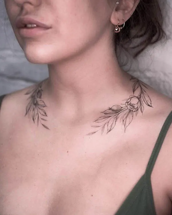Botanical necklace tattoo by @solovyovatattooer