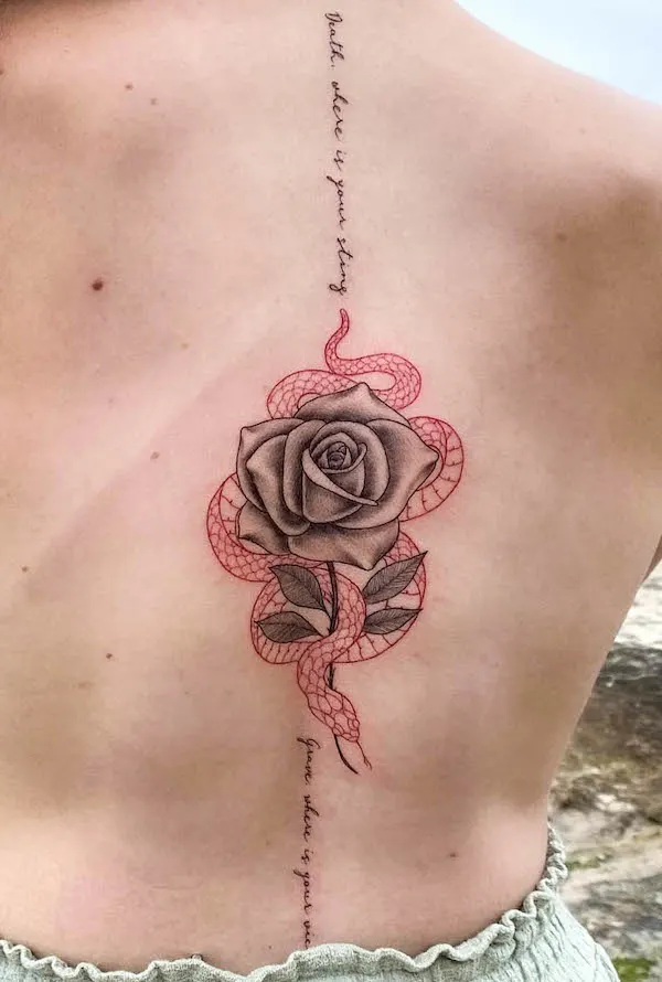 Red snake and rose spine tattoo by @johnb.designs