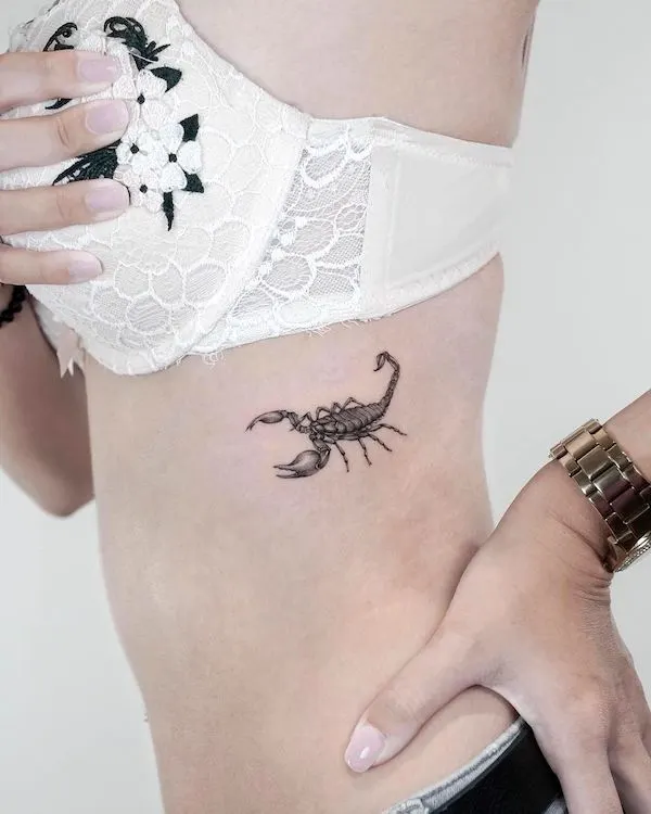 Scorpion rib tattoo for women by @jk.tattoo