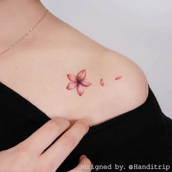 Small cherry blossom and petals tattoo by @handitrip
