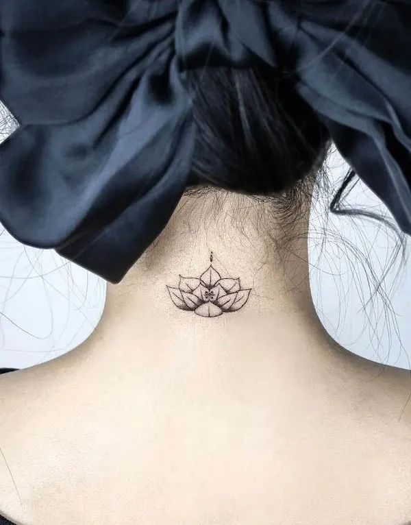 Small lotus back of the neck tattoo by @day_zi_tatt