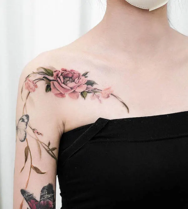 Stunning flower arm and collarbone tattoo by @guppy.flowertattoo