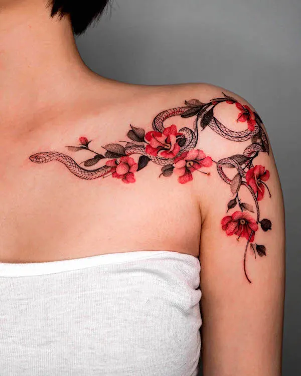 Stunning snake shoulder tattoo for women by @onyo_ttt