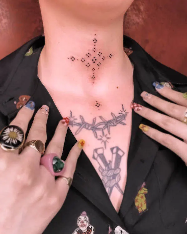 Symbolic ornament throat tattoo by @slowpokes__
