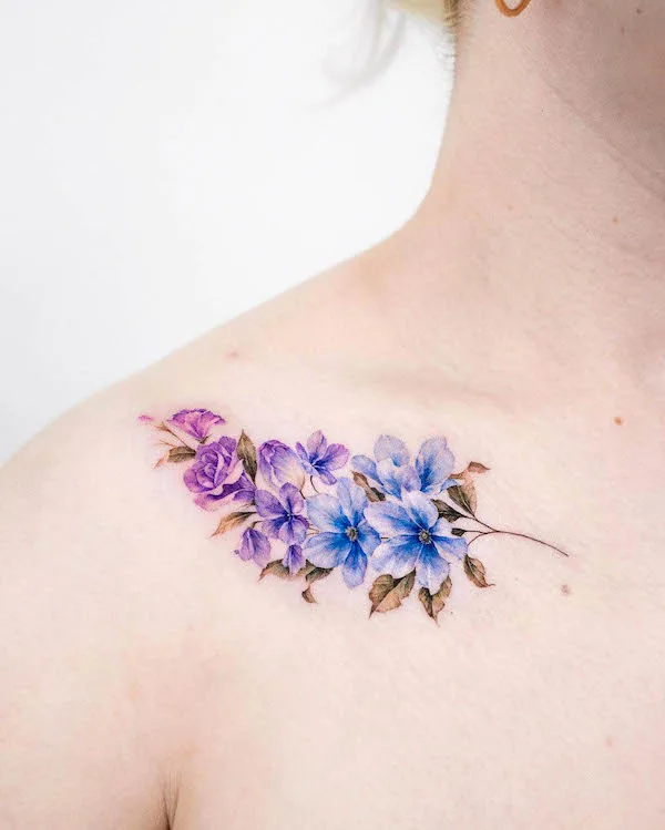 Two-color flower collarbone tattoo by @donghwa_tattoo