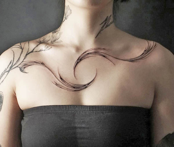 Whimsical swirl collarbone tattoo for women by @tattooist.pado_