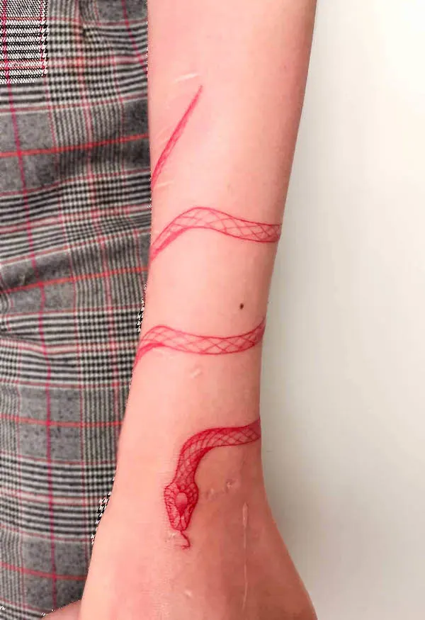 Wrap around the arm red snake tattoo by @frannk.tattoo