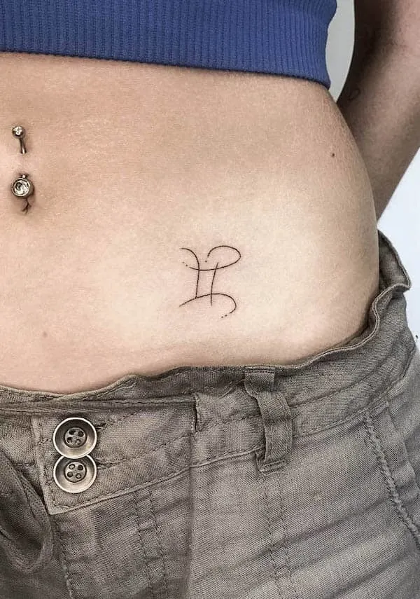 Abstract Gemini symbol waist tattoo by @pokeyhontastattoo
