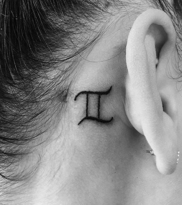 Gemini symbol behind the ear tattoo by @miriam.freemind