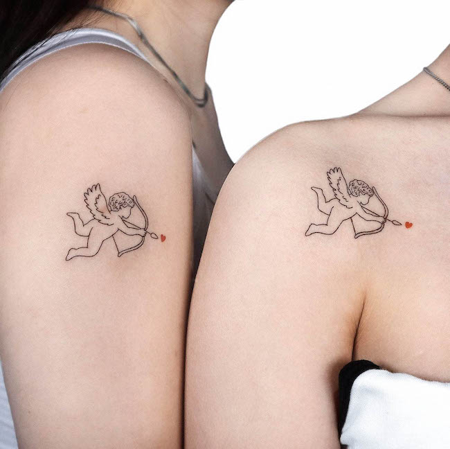Matching Cupid shoulder tattoos for best friends by @gigi_tattooer