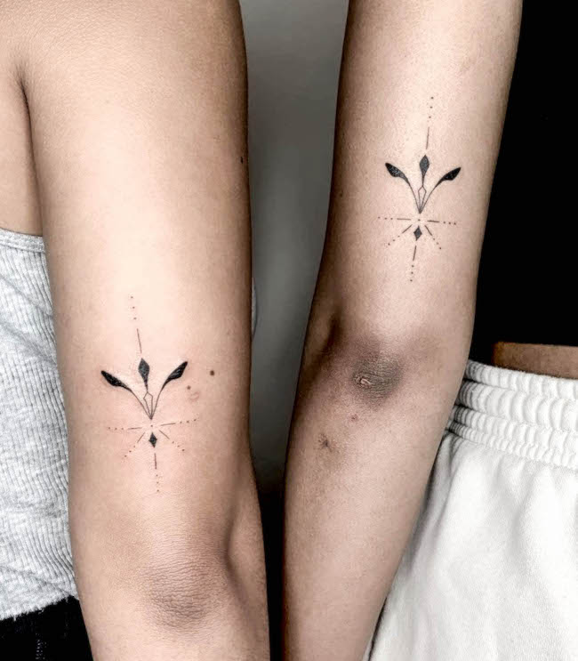 Matching ornamental tattoos by @reena.tattoo