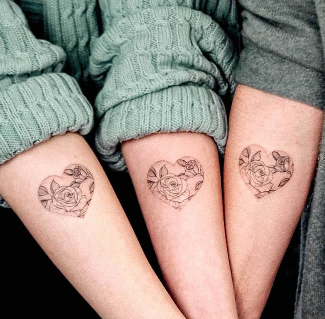 Matching rose tattoos for best friends by @bunami.ink_