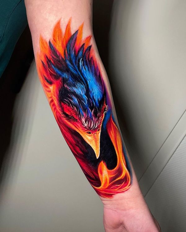 Realism fire phoenix tattoo by @adrienn.kern_
