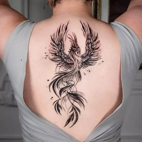 Black phoenix on the back  by @alice_b_jb