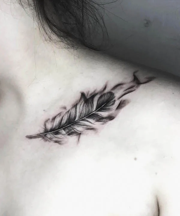 Black phoenix feather collarbone tattoo by @anamadysun