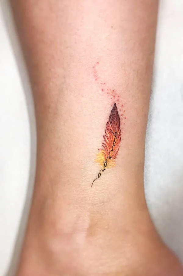 Phoenix feather tattoo by @disegnarti
