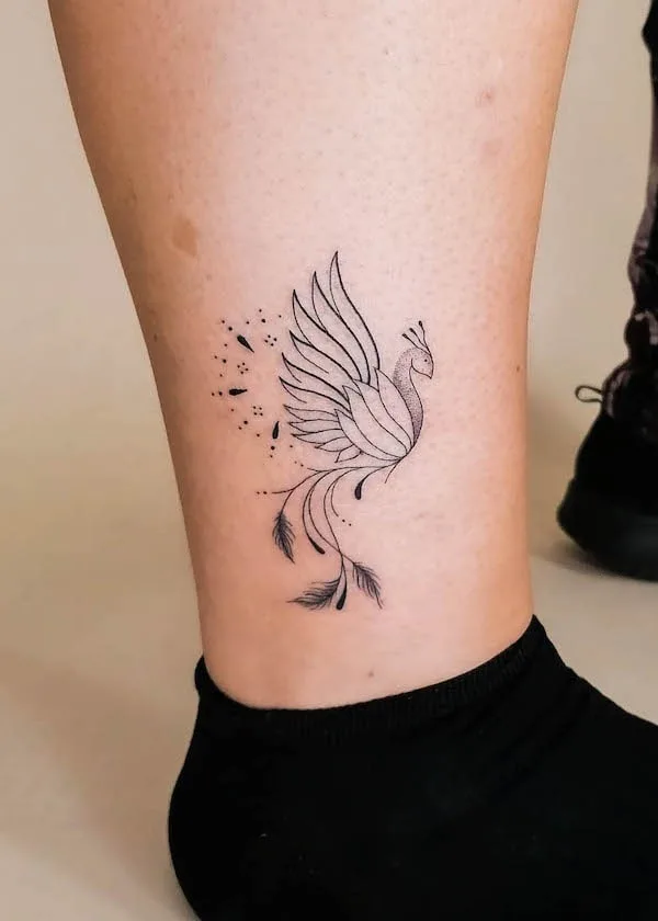 Small ornamental phoenix on the ankle by @kimkoss.ink_