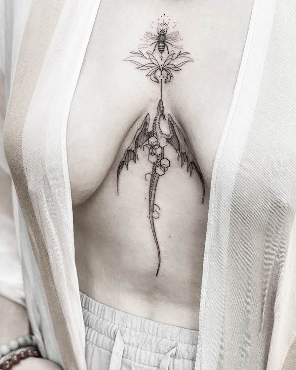 Dragon and bee sternum tattoo by @waitakerewitch