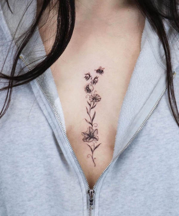 Elegant bee between the boobs tattoo by @modoink_vivi