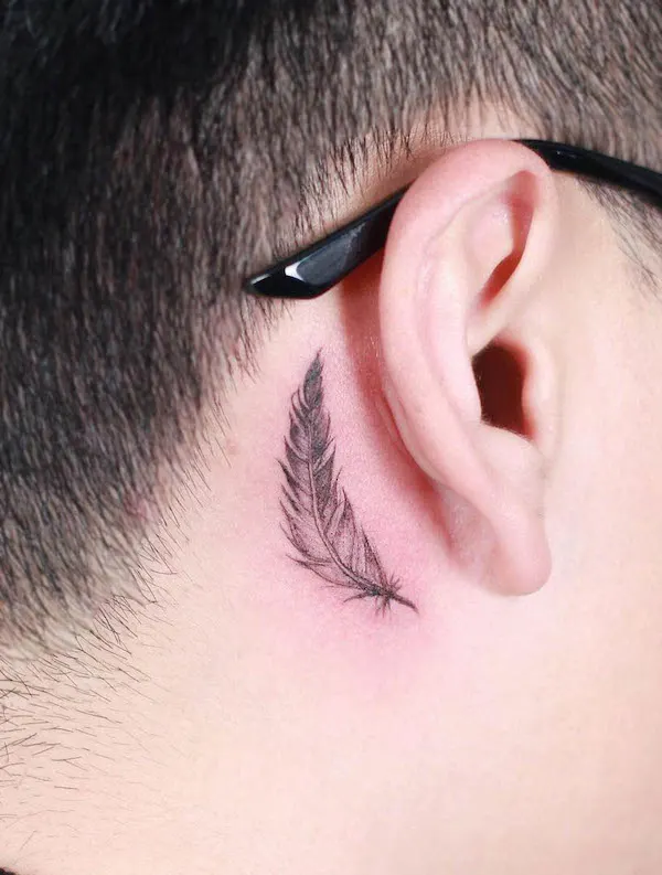 Feather tattoo behind the ear by @inkhome